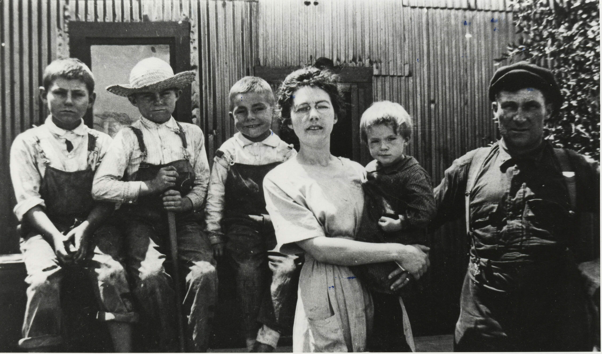 ca. 1918 – A. B. Stein is now a Master Mechanic, and is pictured with his family in front of their house in Smeltertown. Pictured from left to right: •    Walter, age 10 •    Alfred, age 8 •    Martin, age 6 •    Frances age 2