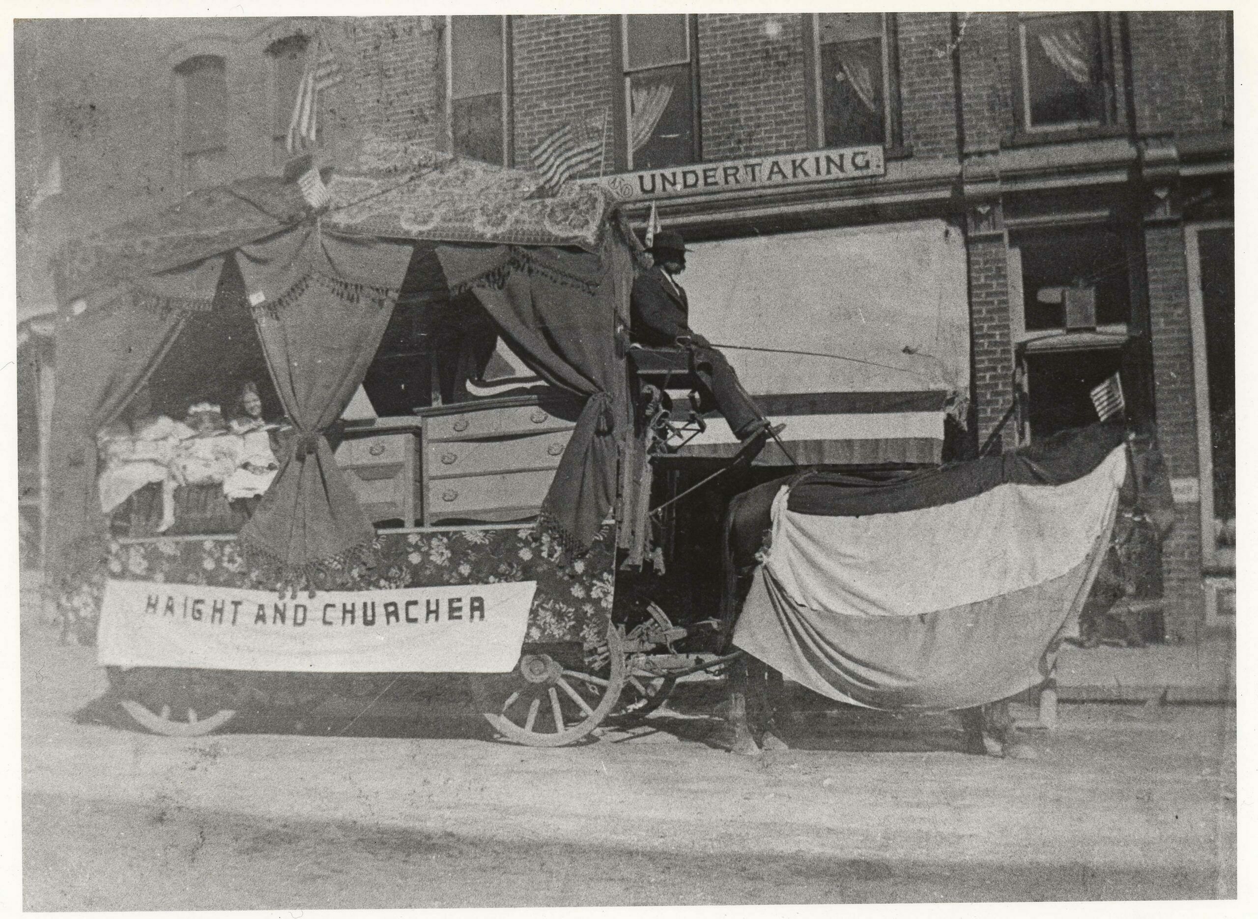 Haight and Churcher Furniture and Undertaking. Frank Churcher is driving.