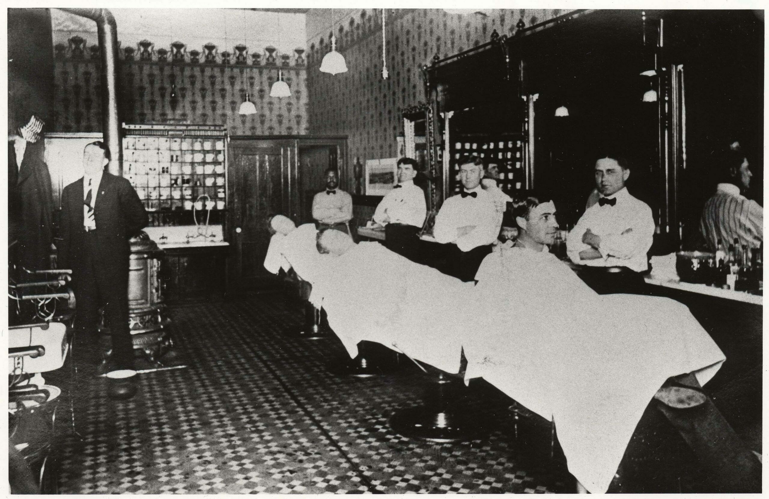 Despite a schedule that included overseeing construction of the big Ohio and Colorado smokestack in 1917, getting married, and being promoted to superintendent at the smelter, Arthur Theodore Thomson (in the chair at the right) took time for a shave and a haircut at Manful’s Barbershop at 109 F Street in Salida.  (1)