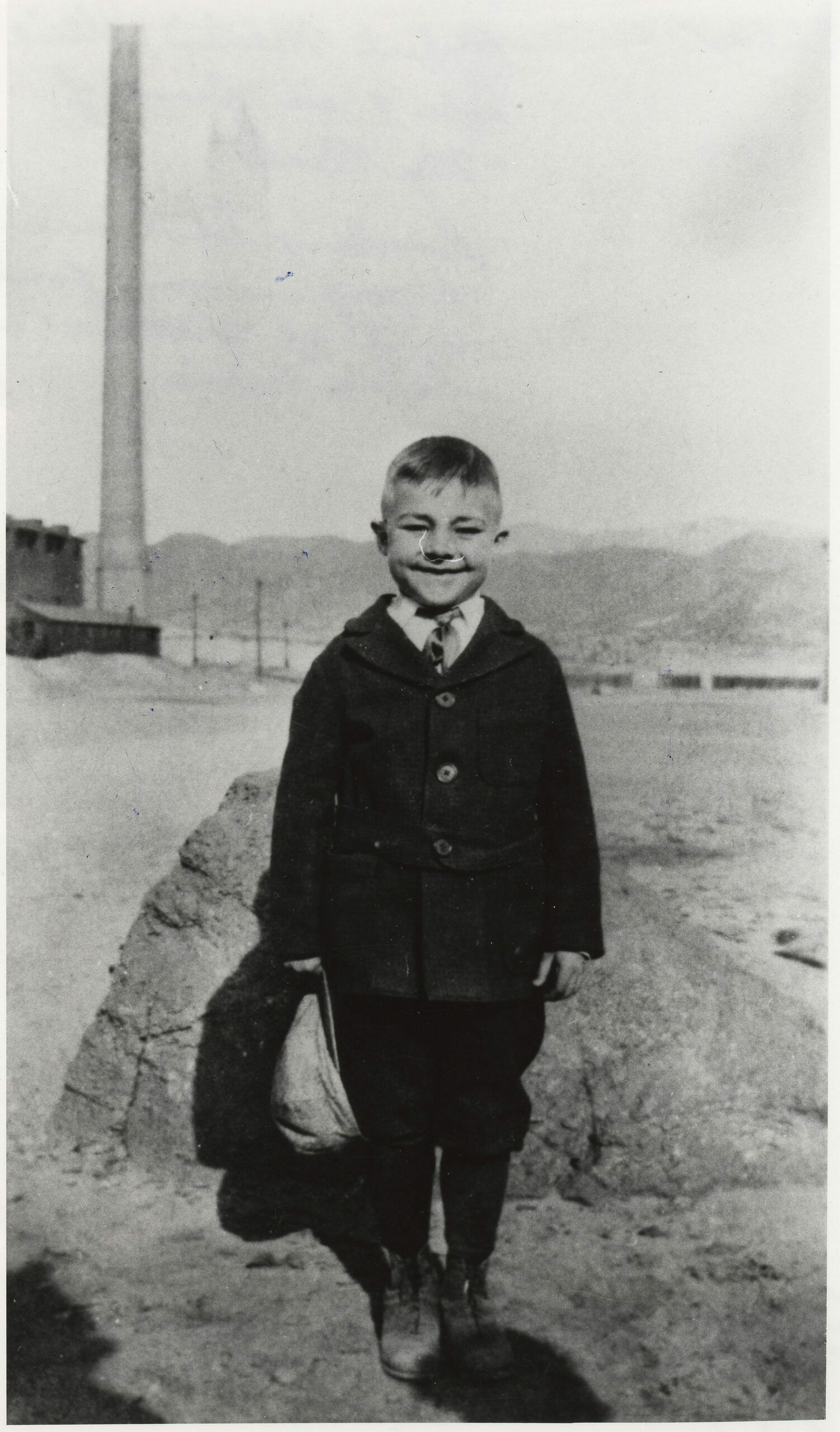 1919 – Robert Martin Stein, age 7, in front of “My Rock” looking East, and happy in his first suit of clothes (home-made).