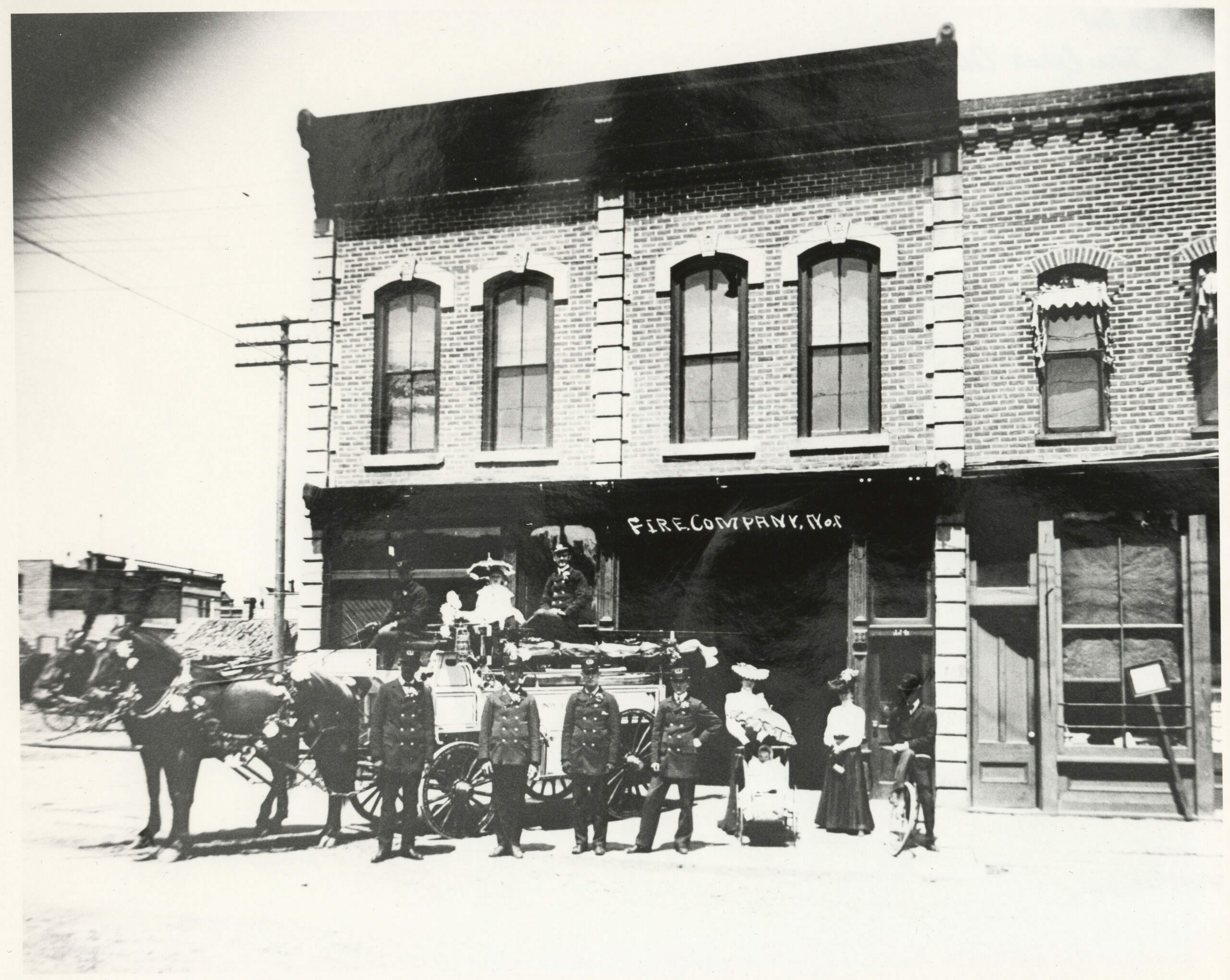 Construction rubble is heaped in the open space beyond the horses hitched to Salida’s new chemical and ladder truck about 1903. Unidentified firemen wear new dress uniforms, and harness on the team is complete with fancy decorations and feather plumes attached to the top of the bridles. When the town council outgrew its first offices, members bought Fraternity Hall at 140 E St. and moved the new fire equipment in downstairs and took the upstairs for city offices. By 1911, firemen were moved into the building at the right and city offices expanded onto both floors in Fraternity Hall. Both buildings are still used for city offices and fire department equipment. This truck is the only one that the fire department doesn’t still have.  (1)